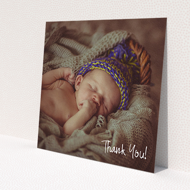 A christening thank you card design named 'Rough but Simple Photo'. It is a square (148mm x 148mm) card in a square orientation. It is a photographic christening thank you card with room for 1 photo. 'Rough but Simple Photo' is available as a flat card, with mainly white colouring.
