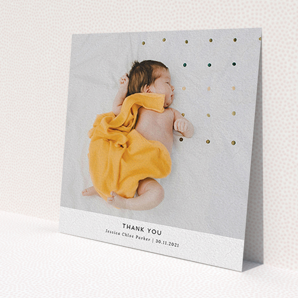 A christening thank you card called 'Sans Serif'. It is a square (148mm x 148mm) card in a square orientation. It is a photographic christening thank you card with room for 1 photo. 'Sans Serif' is available as a flat card, with mainly white colouring.