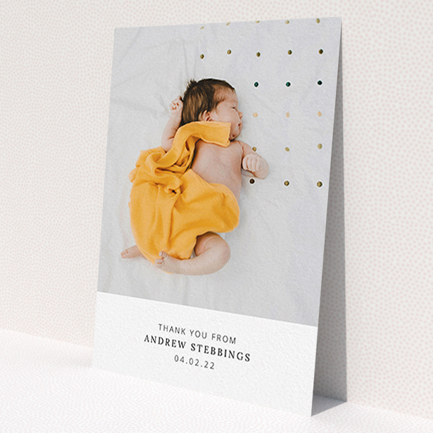 A christening thank you card named 'Simple, Portrait Thank You'. It is an A6 card in a portrait orientation. It is a photographic christening thank you card with room for 1 photo. 'Simple, Portrait Thank You' is available as a flat card, with mainly white colouring.