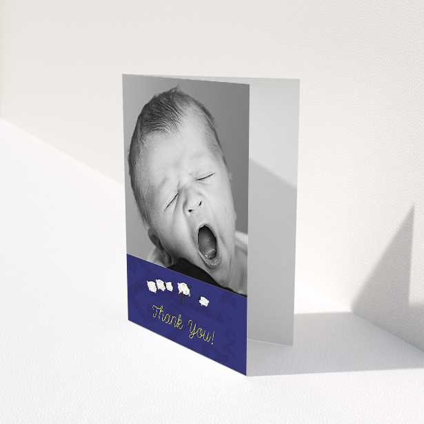 A christening thank you card design called "Sleepy Time". It is an A5 card in a portrait orientation. It is a photographic christening thank you card with room for 1 photo. "Sleepy Time" is available as a folded card, with tones of blue and white.