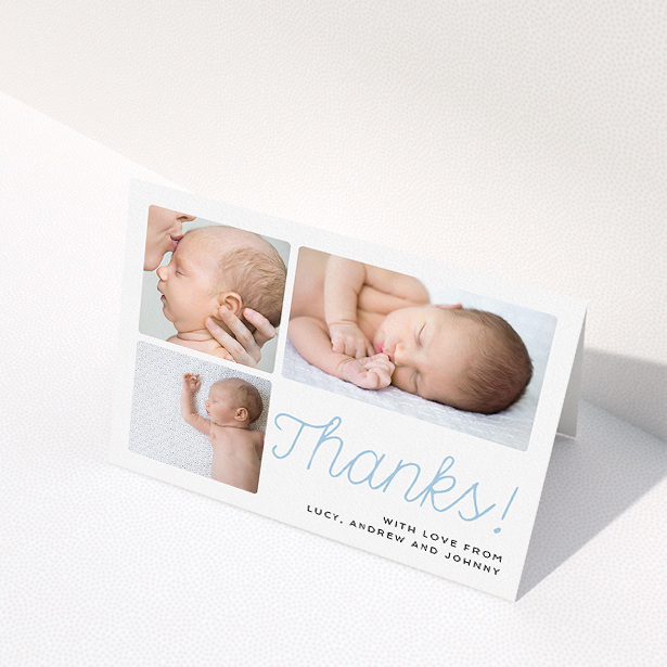 A christening thank you card called "Thank You Cursive". It is an A5 card in a landscape orientation. It is a photographic christening thank you card with room for 3 photos. "Thank You Cursive" is available as a folded card, with tones of white and blue.