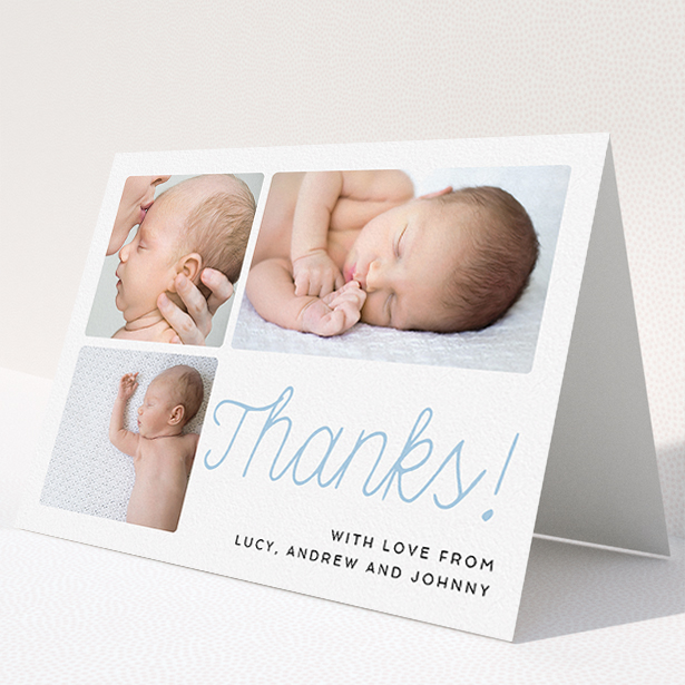 A christening thank you card called "Thank You Cursive". It is an A5 card in a landscape orientation. It is a photographic christening thank you card with room for 3 photos. "Thank You Cursive" is available as a folded card, with tones of white and blue.
