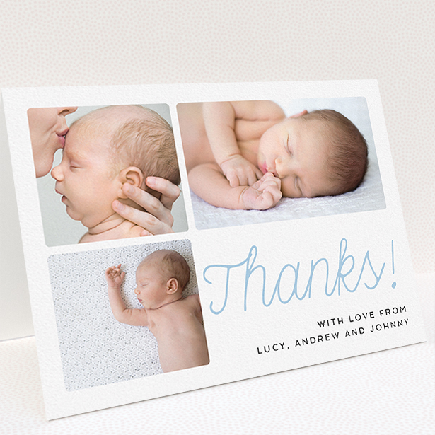 A christening thank you card called "Thank You Cursive". It is an A5 card in a landscape orientation. It is a photographic christening thank you card with room for 3 photos. "Thank You Cursive" is available as a folded card, with tones of white and blue.