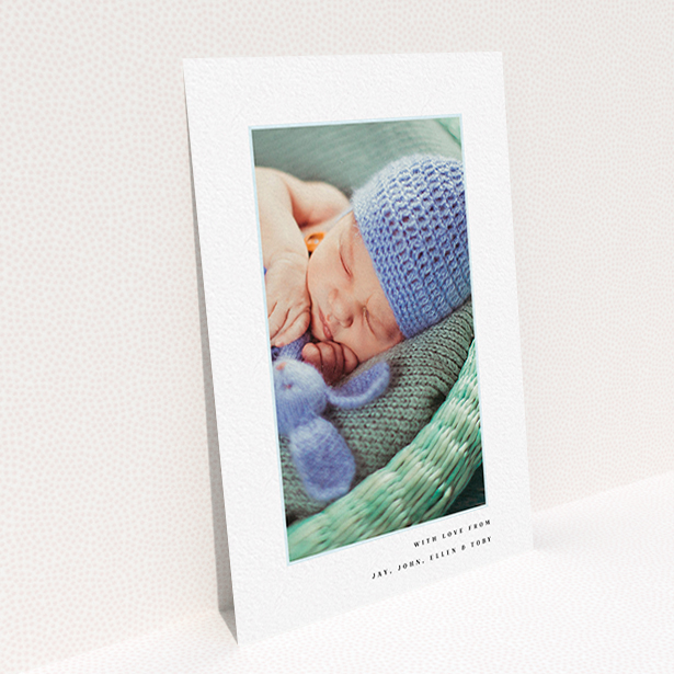 A christening thank you card template titled "Thin Blue Frame". It is an A6 card in a portrait orientation. It is a photographic christening thank you card with room for 1 photo. "Thin Blue Frame" is available as a flat card, with tones of white and blue.