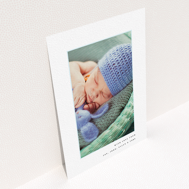 A christening thank you card template titled "Thin Blue Frame". It is an A6 card in a portrait orientation. It is a photographic christening thank you card with room for 1 photo. "Thin Blue Frame" is available as a flat card, with tones of white and blue.