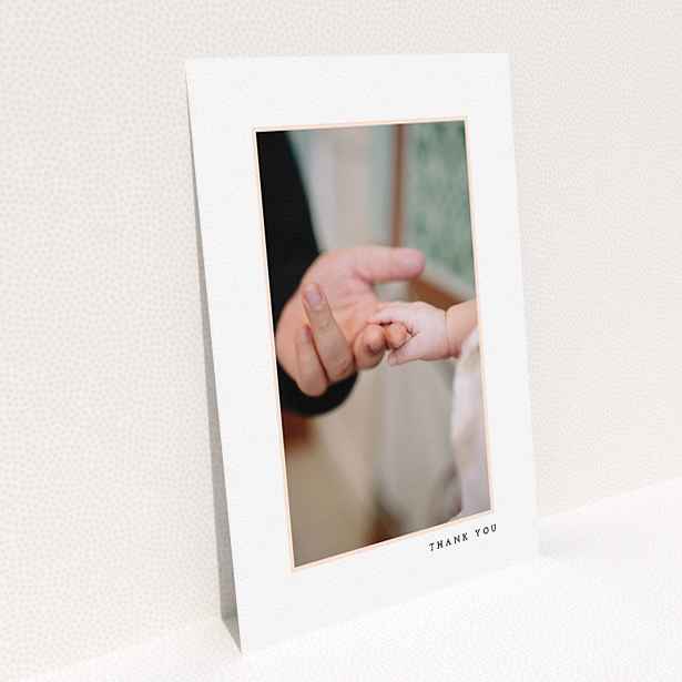 A christening thank you card called "Thin Pink Frame". It is an A5 card in a portrait orientation. It is a photographic christening thank you card with room for 1 photo. "Thin Pink Frame" is available as a flat card, with tones of white and pink.