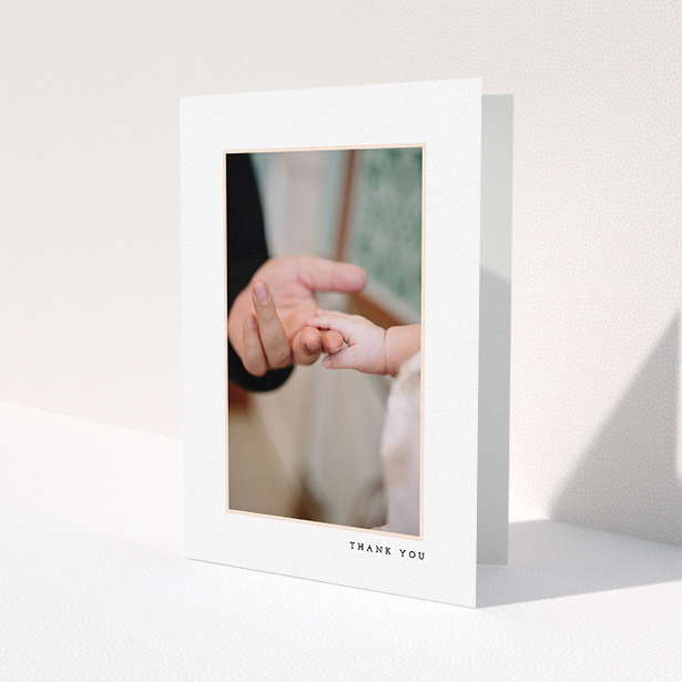 A christening thank you card called 'Thin Pink Frame'. It is an A5 card in a portrait orientation. It is a photographic christening thank you card with room for 1 photo. 'Thin Pink Frame' is available as a folded card, with tones of white and pink.