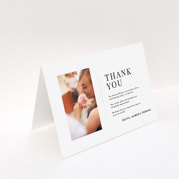 A christening thank you card template titled "Tiny Portrait". It is an A6 card in a landscape orientation. It is a photographic christening thank you card with room for 1 photo. "Tiny Portrait" is available as a folded card, with mainly white colouring.