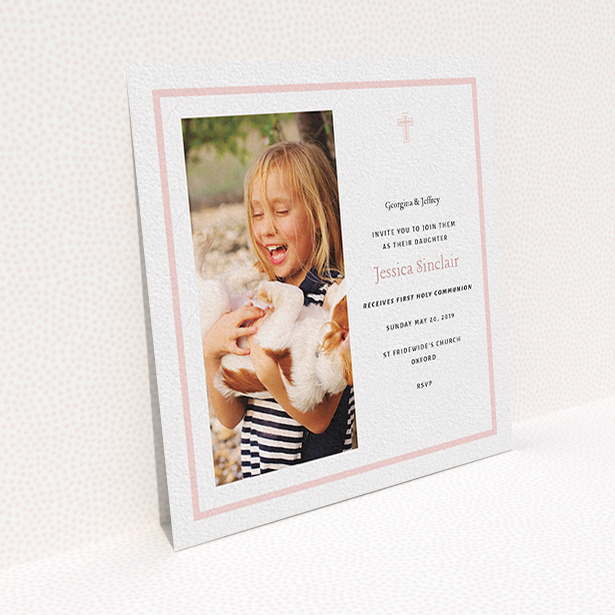 A communion invitation called "Baby Pink Cross". It is a square (148mm x 148mm) invite in a square orientation. It is a photographic communion invitation with room for 1 photo. "Baby Pink Cross" is available as a flat invite, with tones of pink and white.