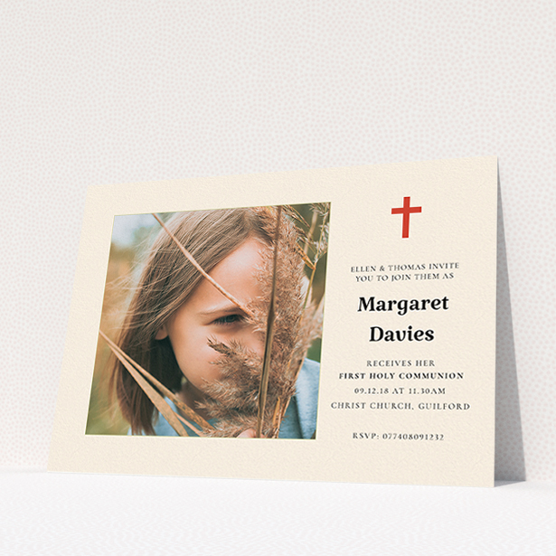 A communion invitation template titled "Red Cross". It is an A5 invite in a landscape orientation. It is a photographic communion invitation with room for 1 photo. "Red Cross" is available as a flat invite, with tones of red and cream.