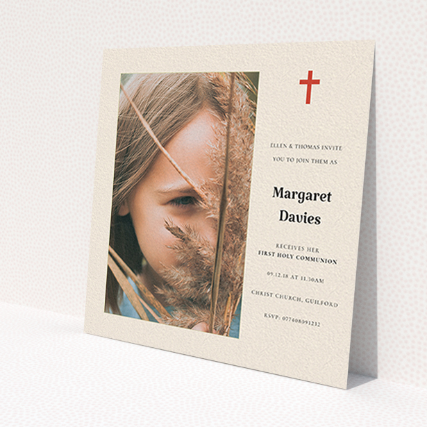 A communion invite card design named 'Red Cross'. It is a square (148mm x 148mm) invite in a square orientation. It is a photographic communion invite card with room for 1 photo. 'Red Cross' is available as a flat invite, with tones of red and cream.