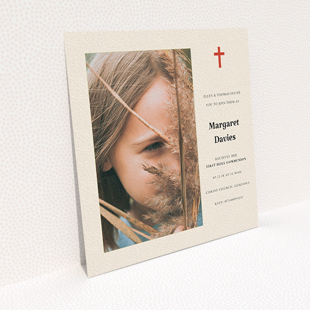 A communion invite card design named "Red Cross". It is a square (148mm x 148mm) invite in a square orientation. It is a photographic communion invite card with room for 1 photo. "Red Cross" is available as a flat invite, with tones of red and cream.
