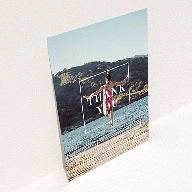 A communion thank you card template titled "Central Thanks". It is an A5 card in a portrait orientation. It is a photographic communion thank you card with room for 1 photo. "Central Thanks" is available as a flat card, with mainly white colouring.