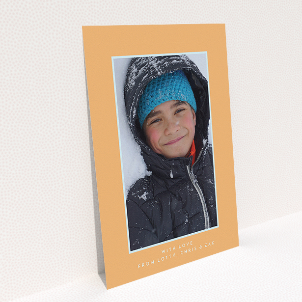 A communion thank you card design titled "Orange and Mint". It is an A5 card in a portrait orientation. It is a photographic communion thank you card with room for 1 photo. "Orange and Mint" is available as a flat card, with tones of orange and blue.