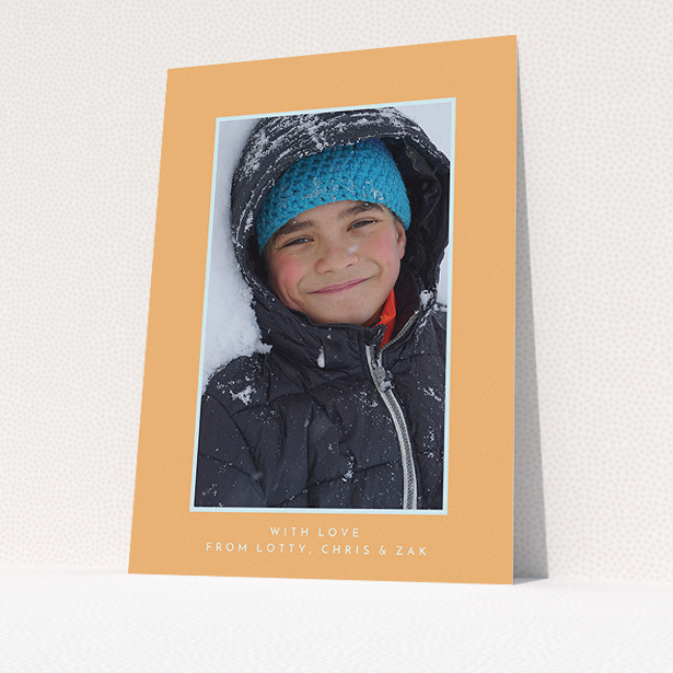 A communion thank you card design titled "Orange and Mint". It is an A5 card in a portrait orientation. It is a photographic communion thank you card with room for 1 photo. "Orange and Mint" is available as a flat card, with tones of orange and blue.