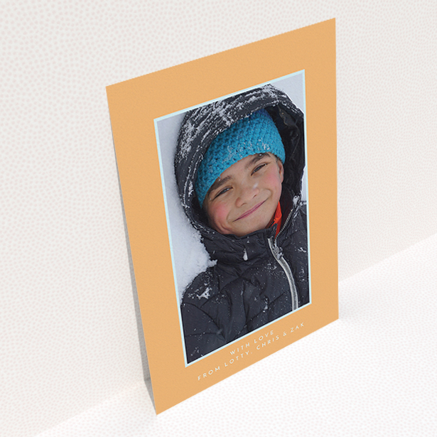 A communion thank you card design titled "Orange and Mint". It is an A5 card in a portrait orientation. It is a photographic communion thank you card with room for 1 photo. "Orange and Mint" is available as a flat card, with tones of orange and blue.