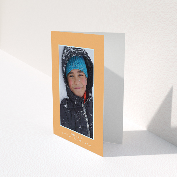 A communion thank you card design titled "Orange and Mint". It is an A5 card in a portrait orientation. It is a photographic communion thank you card with room for 1 photo. "Orange and Mint" is available as a folded card, with tones of orange and blue.
