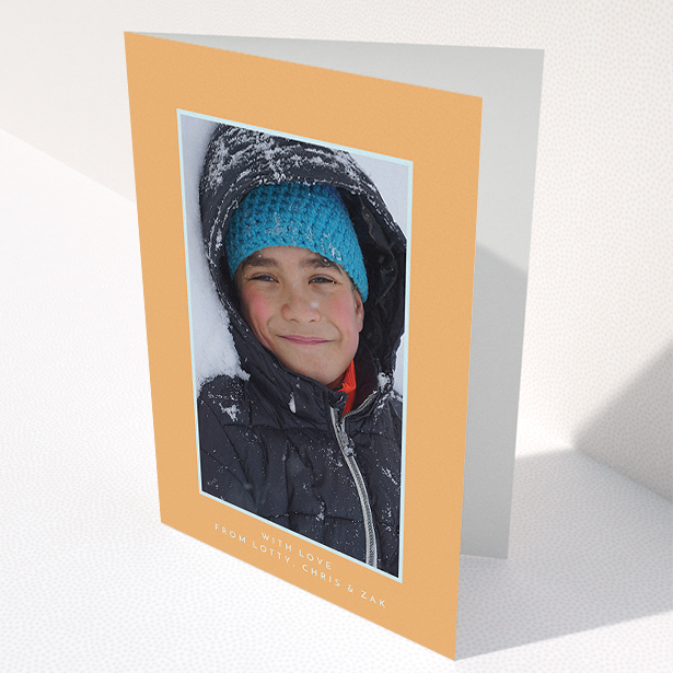 A communion thank you card design titled "Orange and Mint". It is an A5 card in a portrait orientation. It is a photographic communion thank you card with room for 1 photo. "Orange and Mint" is available as a folded card, with tones of orange and blue.