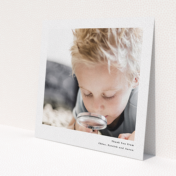A communion thank you card design titled 'Simple Portrait'. It is a square (148mm x 148mm) card in a square orientation. It is a photographic communion thank you card with room for 1 photo. 'Simple Portrait' is available as a flat card, with mainly white colouring.