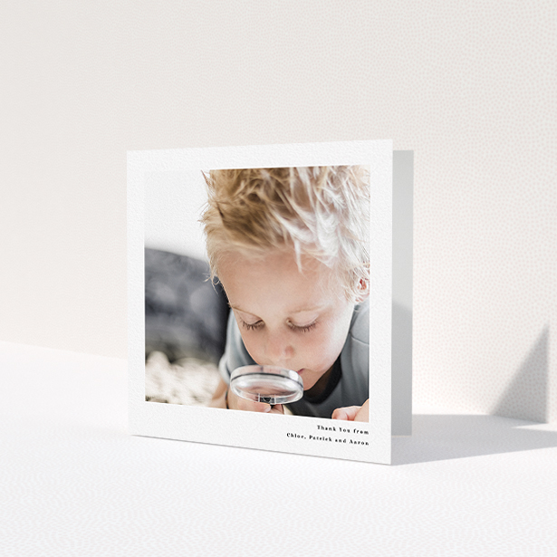 A communion thank you card design titled 'Simple Portrait'. It is a square (148mm x 148mm) card in a square orientation. It is a photographic communion thank you card with room for 1 photo. 'Simple Portrait' is available as a folded card, with mainly white colouring.