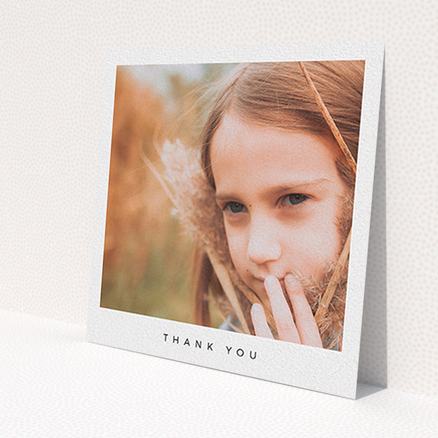 A communion thank you card named 'Simple Thanks'. It is a square (148mm x 148mm) card in a square orientation. It is a photographic communion thank you card with room for 1 photo. 'Simple Thanks' is available as a flat card, with mainly white colouring.