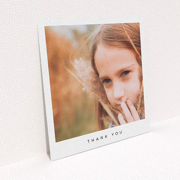 A communion thank you card named "Simple Thanks". It is a square (148mm x 148mm) card in a square orientation. It is a photographic communion thank you card with room for 1 photo. "Simple Thanks" is available as a flat card, with mainly white colouring.