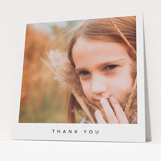A communion thank you card named "Simple Thanks". It is a square (148mm x 148mm) card in a square orientation. It is a photographic communion thank you card with room for 1 photo. "Simple Thanks" is available as a flat card, with mainly white colouring.