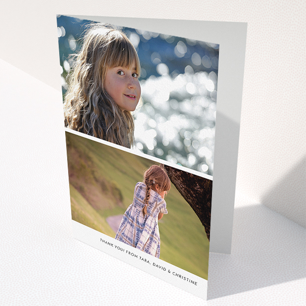 A communion thank you card named "Stacked Landscapes". It is an A5 card in a portrait orientation. It is a photographic communion thank you card with room for 2 photos. "Stacked Landscapes" is available as a folded card, with mainly white colouring.