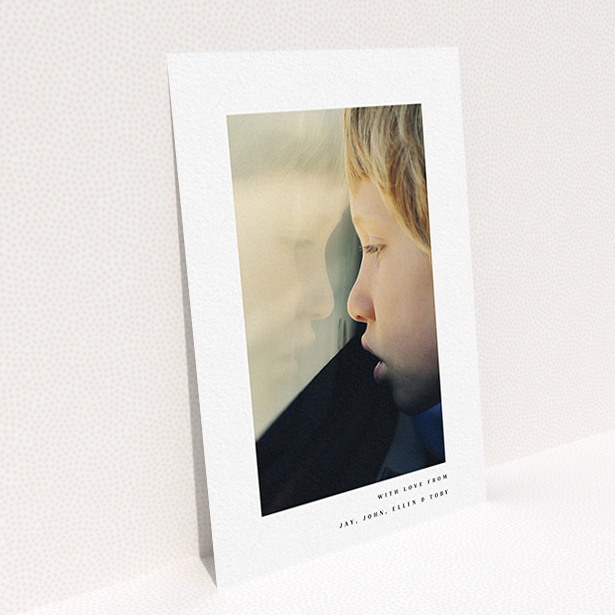 A communion thank you card template titled "Thin Blue Frame". It is an A6 card in a portrait orientation. It is a photographic communion thank you card with room for 1 photo. "Thin Blue Frame" is available as a flat card, with mainly white colouring.