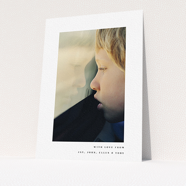 A communion thank you card template titled "Thin Blue Frame". It is an A6 card in a portrait orientation. It is a photographic communion thank you card with room for 1 photo. "Thin Blue Frame" is available as a flat card, with mainly white colouring.