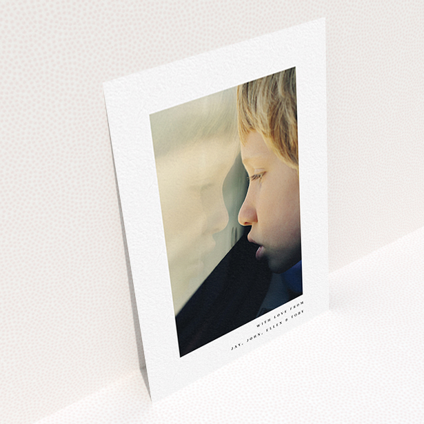A communion thank you card template titled "Thin Blue Frame". It is an A6 card in a portrait orientation. It is a photographic communion thank you card with room for 1 photo. "Thin Blue Frame" is available as a flat card, with mainly white colouring.