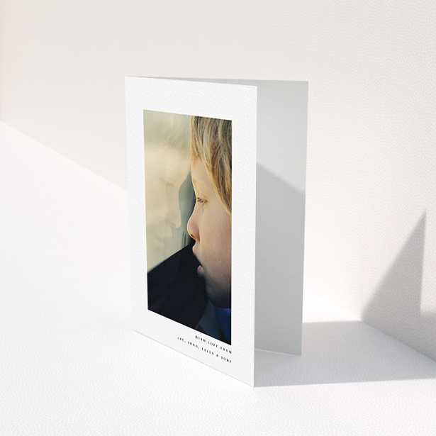 A communion thank you card template titled "Thin Blue Frame". It is an A6 card in a portrait orientation. It is a photographic communion thank you card with room for 1 photo. "Thin Blue Frame" is available as a folded card, with mainly white colouring.