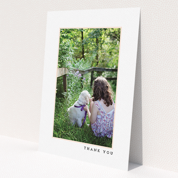 A communion thank you card design called 'Thin Pink Frame'. It is an A5 card in a portrait orientation. It is a photographic communion thank you card with room for 1 photo. 'Thin Pink Frame' is available as a flat card, with tones of white and pink.
