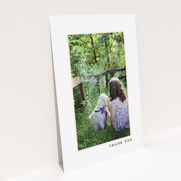 A communion thank you card design called "Thin Pink Frame". It is an A5 card in a portrait orientation. It is a photographic communion thank you card with room for 1 photo. "Thin Pink Frame" is available as a flat card, with tones of white and pink.