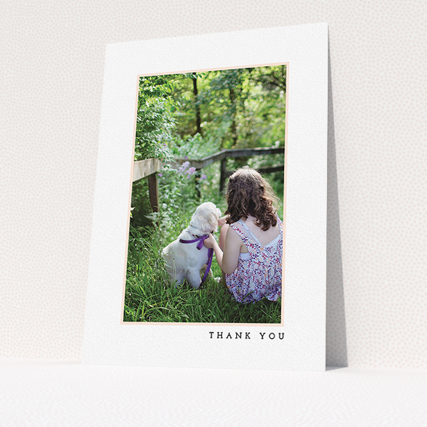 A communion thank you card design called "Thin Pink Frame". It is an A5 card in a portrait orientation. It is a photographic communion thank you card with room for 1 photo. "Thin Pink Frame" is available as a flat card, with tones of white and pink.
