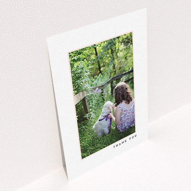 A communion thank you card design called "Thin Pink Frame". It is an A5 card in a portrait orientation. It is a photographic communion thank you card with room for 1 photo. "Thin Pink Frame" is available as a flat card, with tones of white and pink.