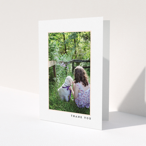 A communion thank you card design called 'Thin Pink Frame'. It is an A5 card in a portrait orientation. It is a photographic communion thank you card with room for 1 photo. 'Thin Pink Frame' is available as a folded card, with tones of white and pink.