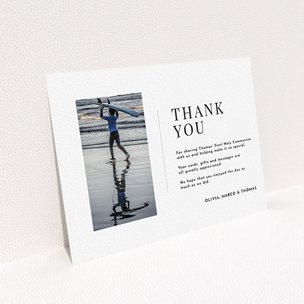 A communion thank you card template titled "Tiny Portrait". It is an A6 card in a landscape orientation. It is a photographic communion thank you card with room for 1 photo. "Tiny Portrait" is available as a flat card, with mainly white colouring.
