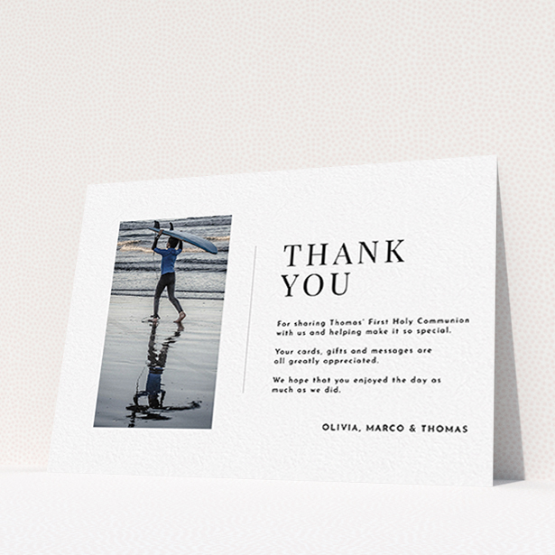 A communion thank you card template titled "Tiny Portrait". It is an A6 card in a landscape orientation. It is a photographic communion thank you card with room for 1 photo. "Tiny Portrait" is available as a flat card, with mainly white colouring.