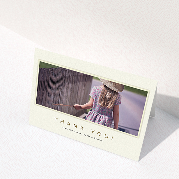 A communion thank you card named "Torn Cream Frame". It is an A6 card in a landscape orientation. It is a photographic communion thank you card with room for 1 photo. "Torn Cream Frame" is available as a folded card, with mainly cream colouring.