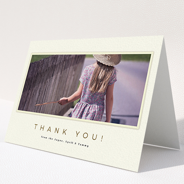 A communion thank you card named "Torn Cream Frame". It is an A6 card in a landscape orientation. It is a photographic communion thank you card with room for 1 photo. "Torn Cream Frame" is available as a folded card, with mainly cream colouring.