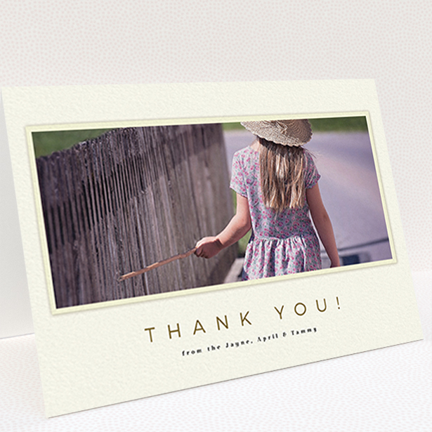 A communion thank you card named "Torn Cream Frame". It is an A6 card in a landscape orientation. It is a photographic communion thank you card with room for 1 photo. "Torn Cream Frame" is available as a folded card, with mainly cream colouring.