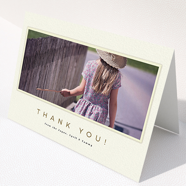 A communion thank you card named "Torn Cream Frame". It is an A6 card in a landscape orientation. It is a photographic communion thank you card with room for 1 photo. "Torn Cream Frame" is available as a folded card, with mainly cream colouring.