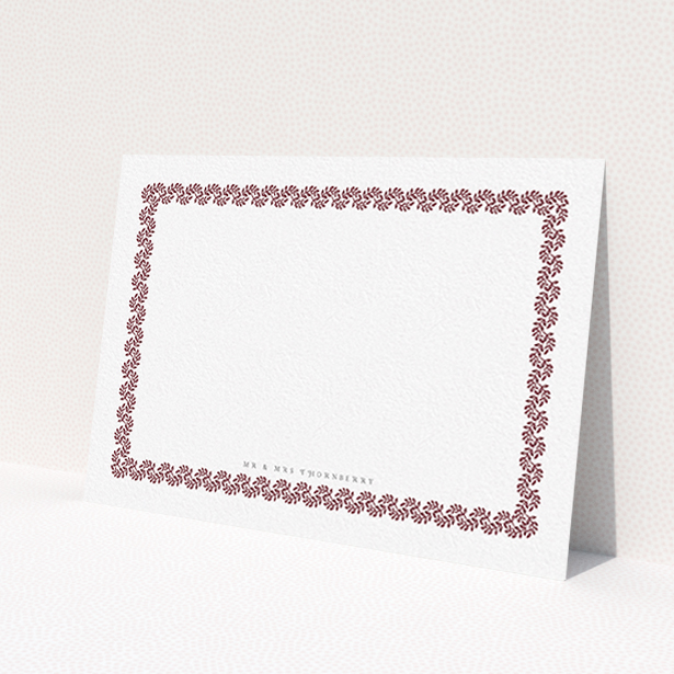 A couples personalised note card named 'Surrounded by the garden maroon'. It is an A6 card in a landscape orientation. 'Surrounded by the garden maroon' is available as a flat card, with tones of burgundy and white.