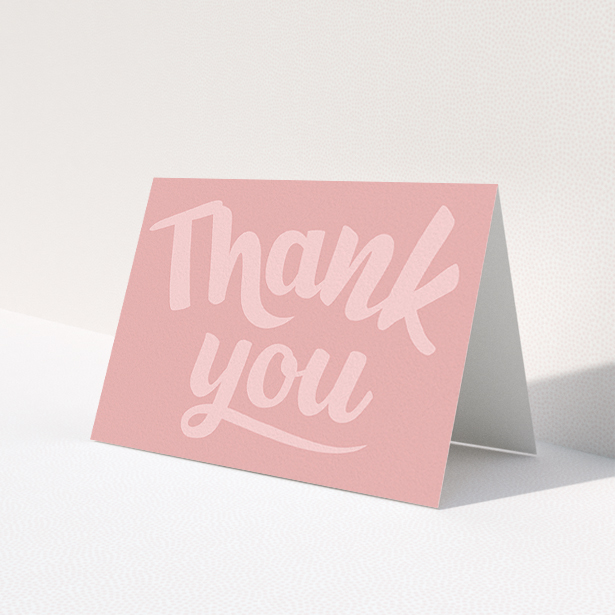 A first holy communion thank you card design titled 'Big Pink Typography'. It is an A6 card in a landscape orientation. 'Big Pink Typography' is available as a folded card, with mainly pink colouring.