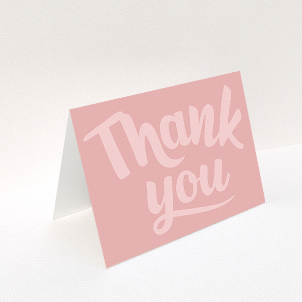 A first holy communion thank you card design titled "Big Pink Typography". It is an A6 card in a landscape orientation. "Big Pink Typography" is available as a folded card, with mainly pink colouring.
