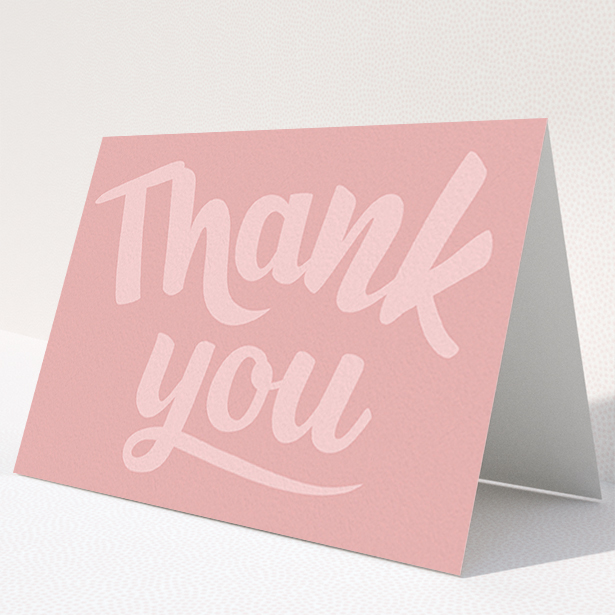 A first holy communion thank you card design titled "Big Pink Typography". It is an A6 card in a landscape orientation. "Big Pink Typography" is available as a folded card, with mainly pink colouring.