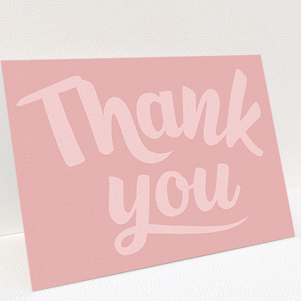 A first holy communion thank you card design titled "Big Pink Typography". It is an A6 card in a landscape orientation. "Big Pink Typography" is available as a folded card, with mainly pink colouring.