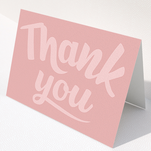 A first holy communion thank you card design titled "Big Pink Typography". It is an A6 card in a landscape orientation. "Big Pink Typography" is available as a folded card, with mainly pink colouring.