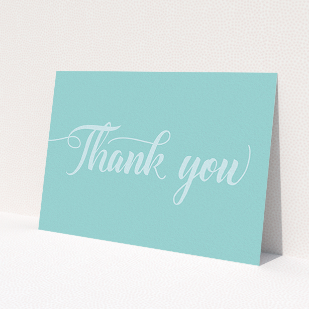 A first holy communion thank you card design named 'Blue on Blue Typography'. It is an A6 card in a landscape orientation. 'Blue on Blue Typography' is available as a flat card, with mainly blue colouring.